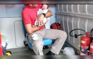 O soldado Lucas Ritixen e o bebê que estava engasgado
