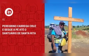 Peregrino carrega cruz e segue a pé até o Santuário de Santa Rita